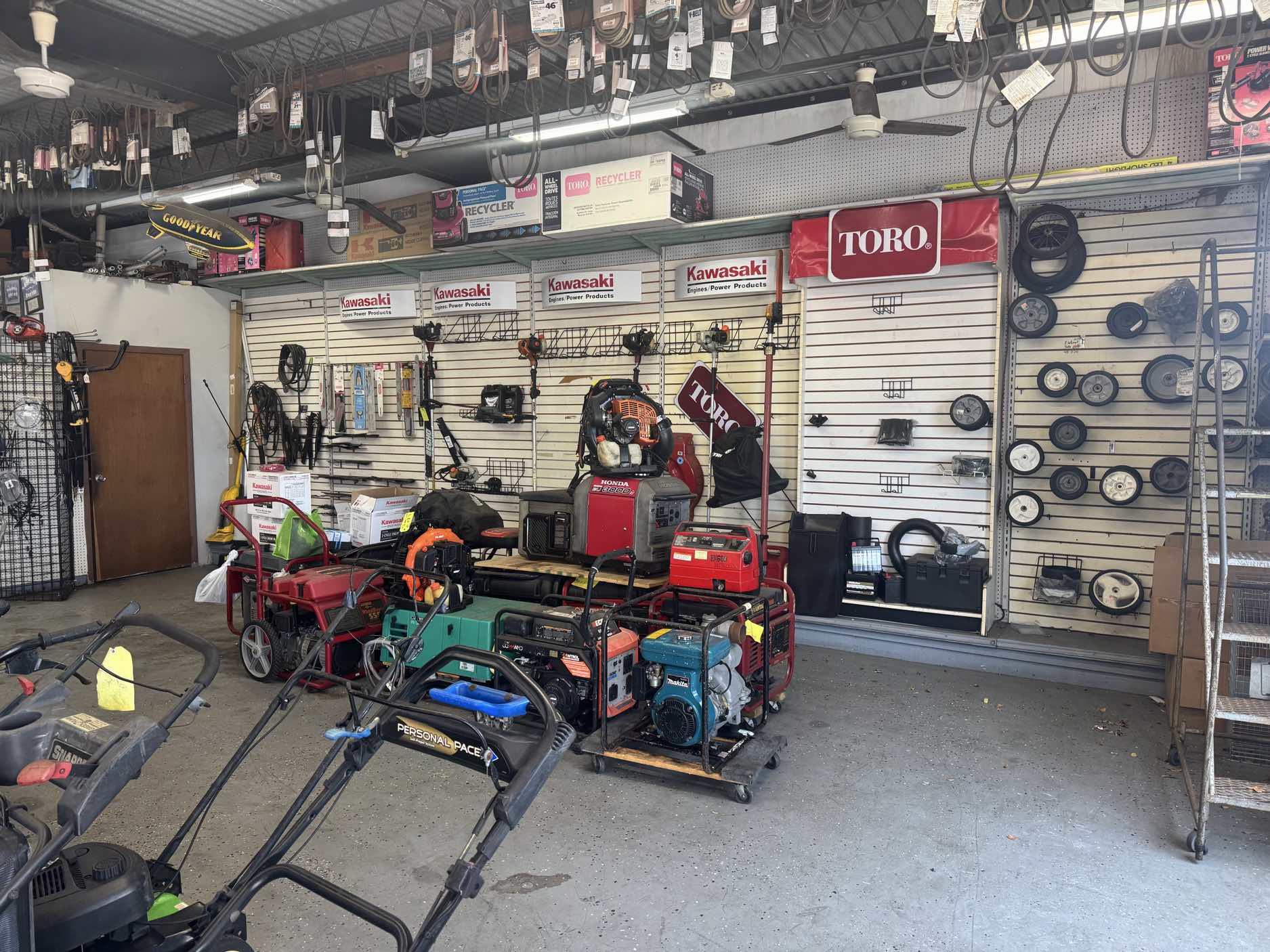 Refurbished generators on display with Toro and Kawasaki signage