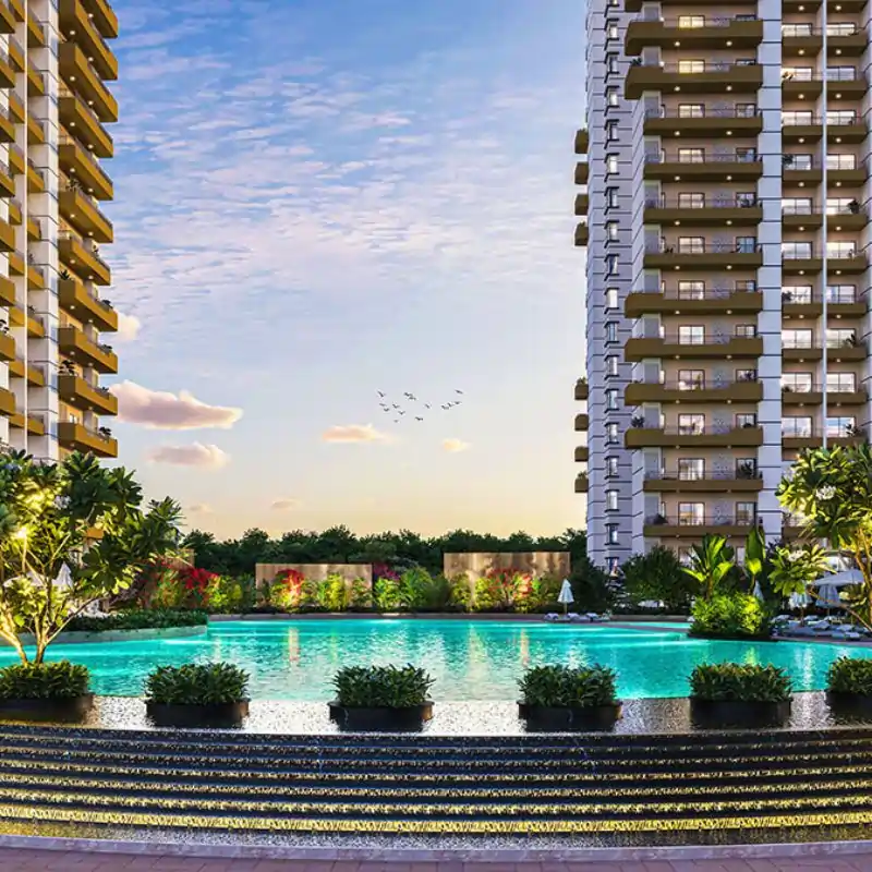 Wave Eden twilight pool view surrounded by luxury high-rise buildings