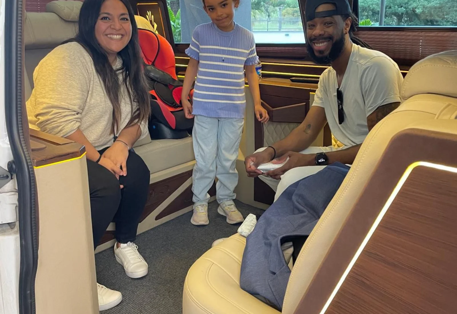 Family with child in luxury van