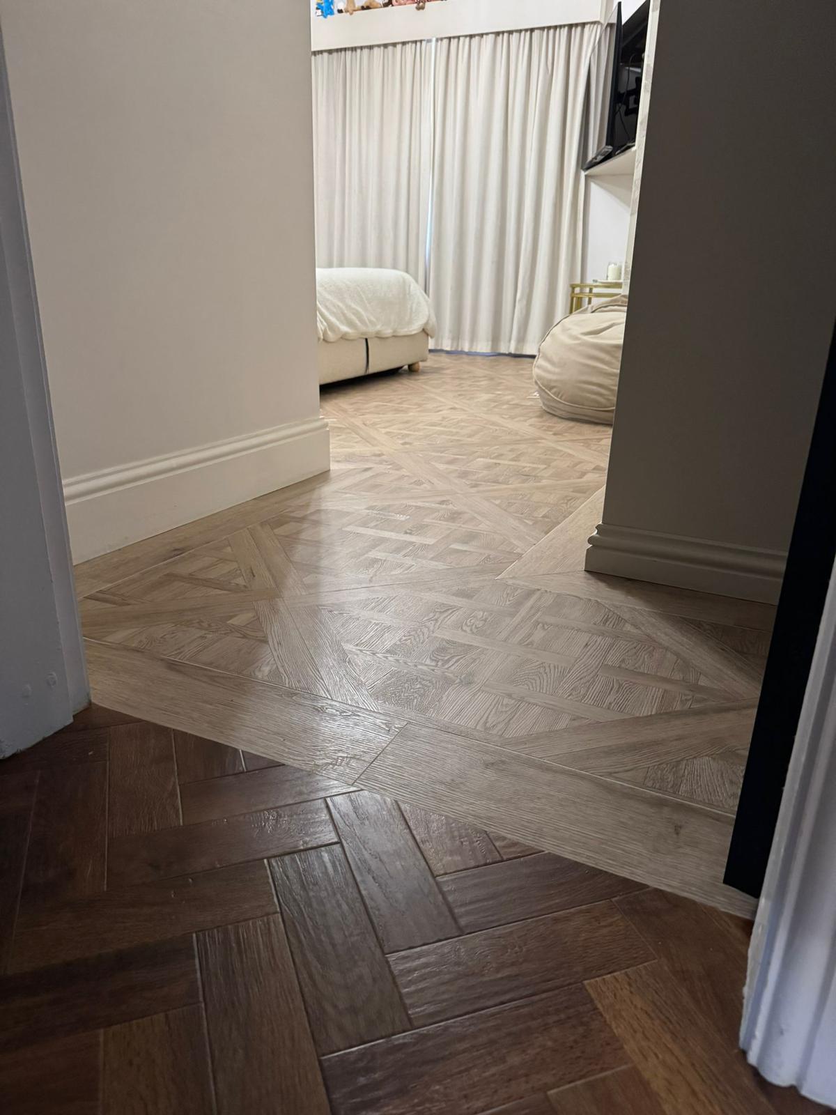 Bedroom with parquet flooring in two tones