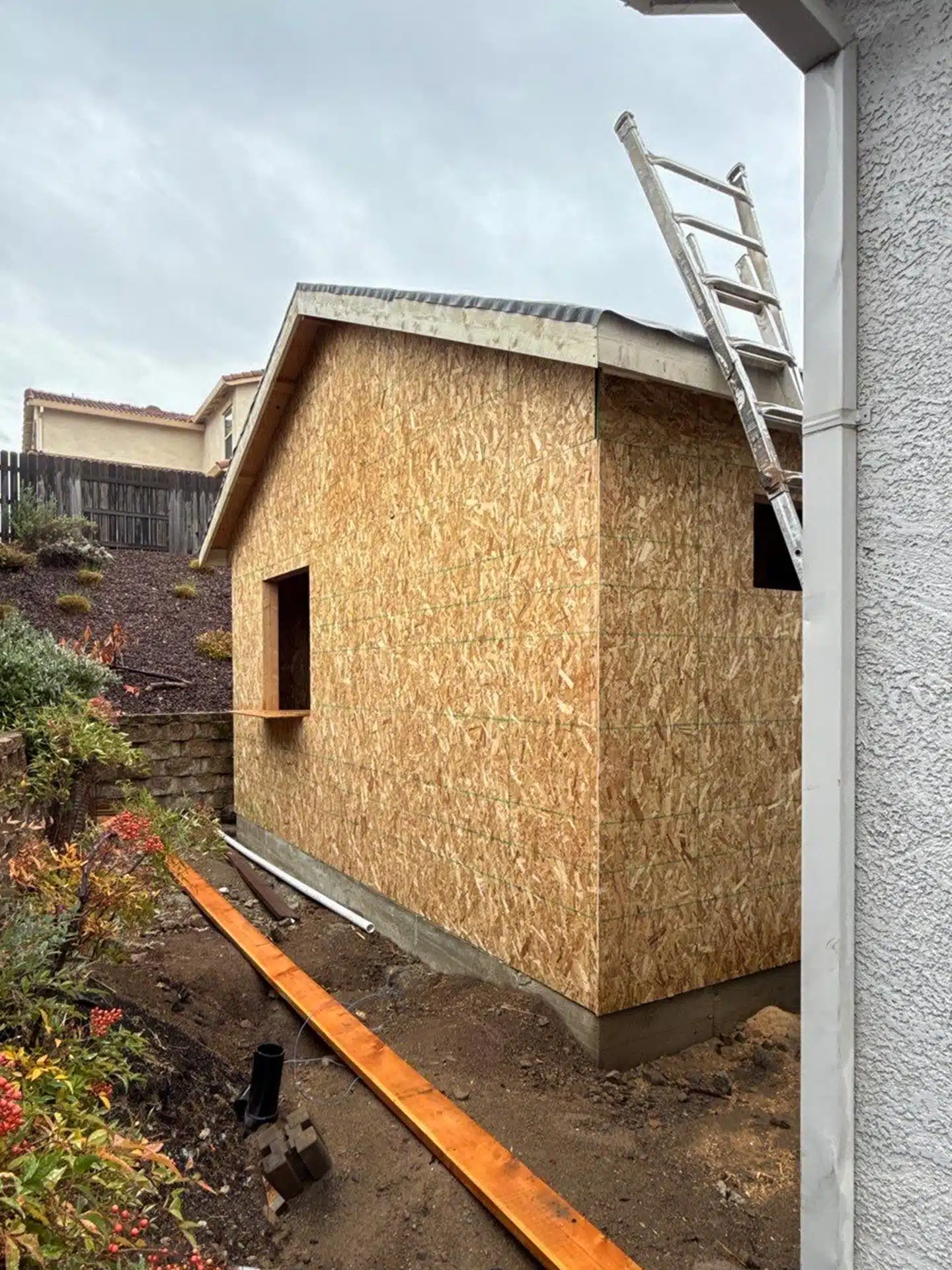 ADU during construction framing phase showing OSB sheathing and roof structure