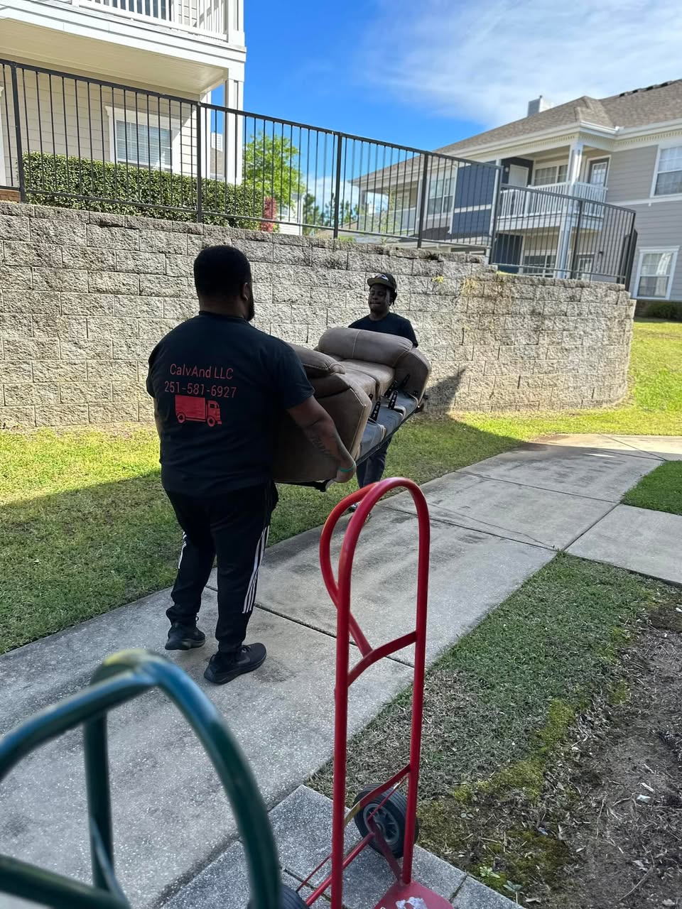 CalvAnd LLC team members moving furniture