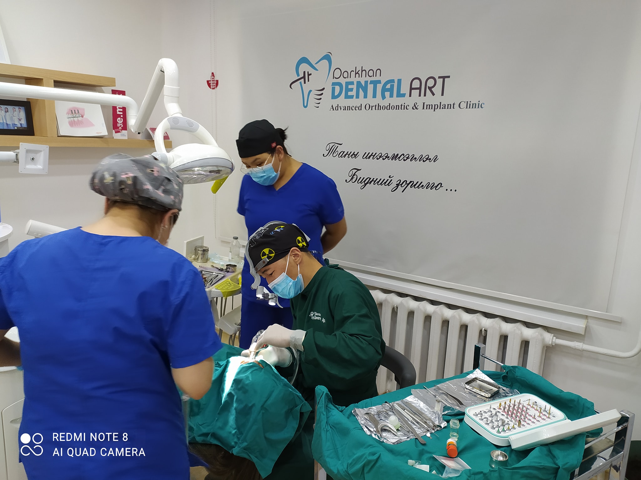 Dental professionals performing treatment at Darkhan Dental Art Clinic