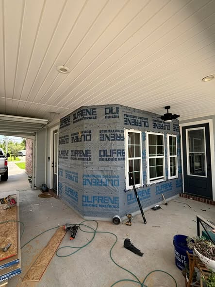 Collins Construction Group porch addition under construction — siding wrapped phase before cladding
