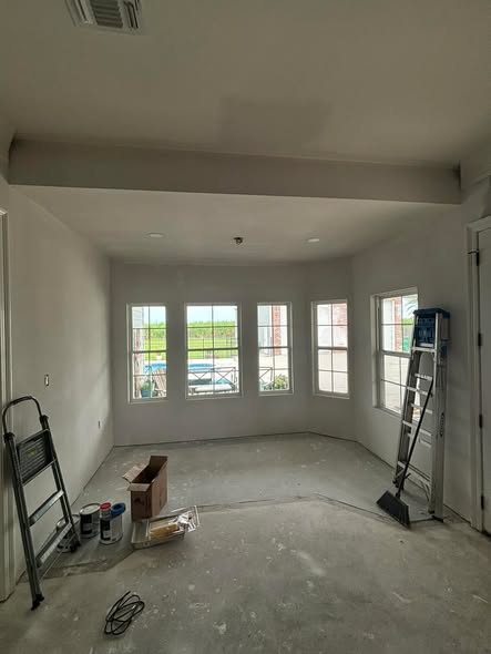 Interior of Collins Construction porch addition mid-renovation — drywall stage
