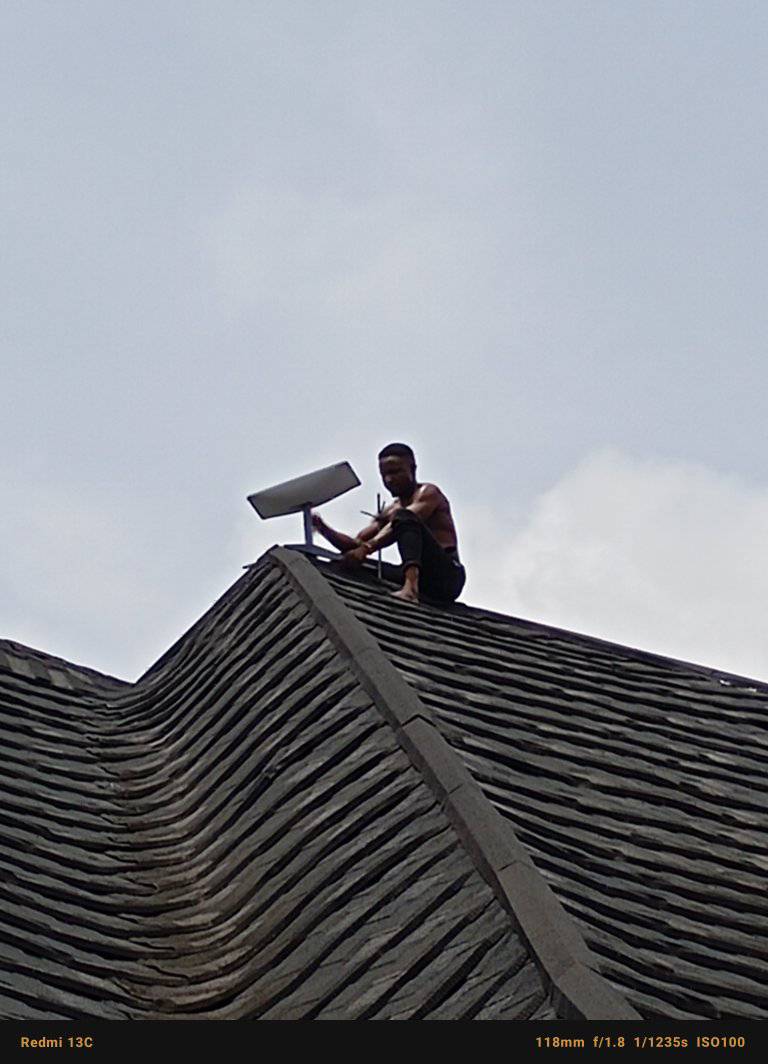 OLW technician installing solar panel on rooftop