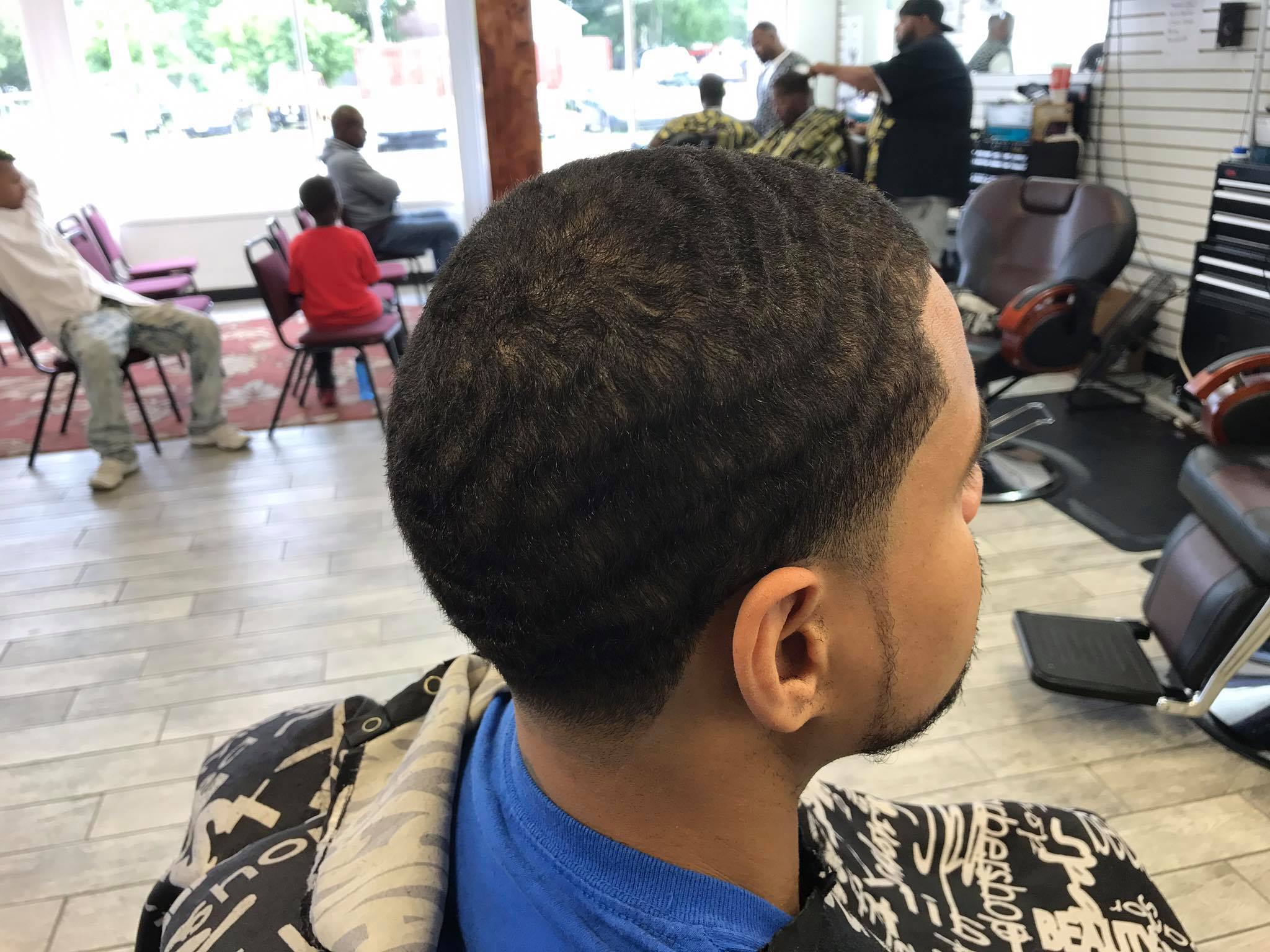 Clean waves haircut with precision taper