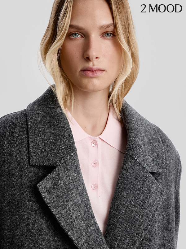 2Mood catalogue — blonde model in a grey coat and pink shirt