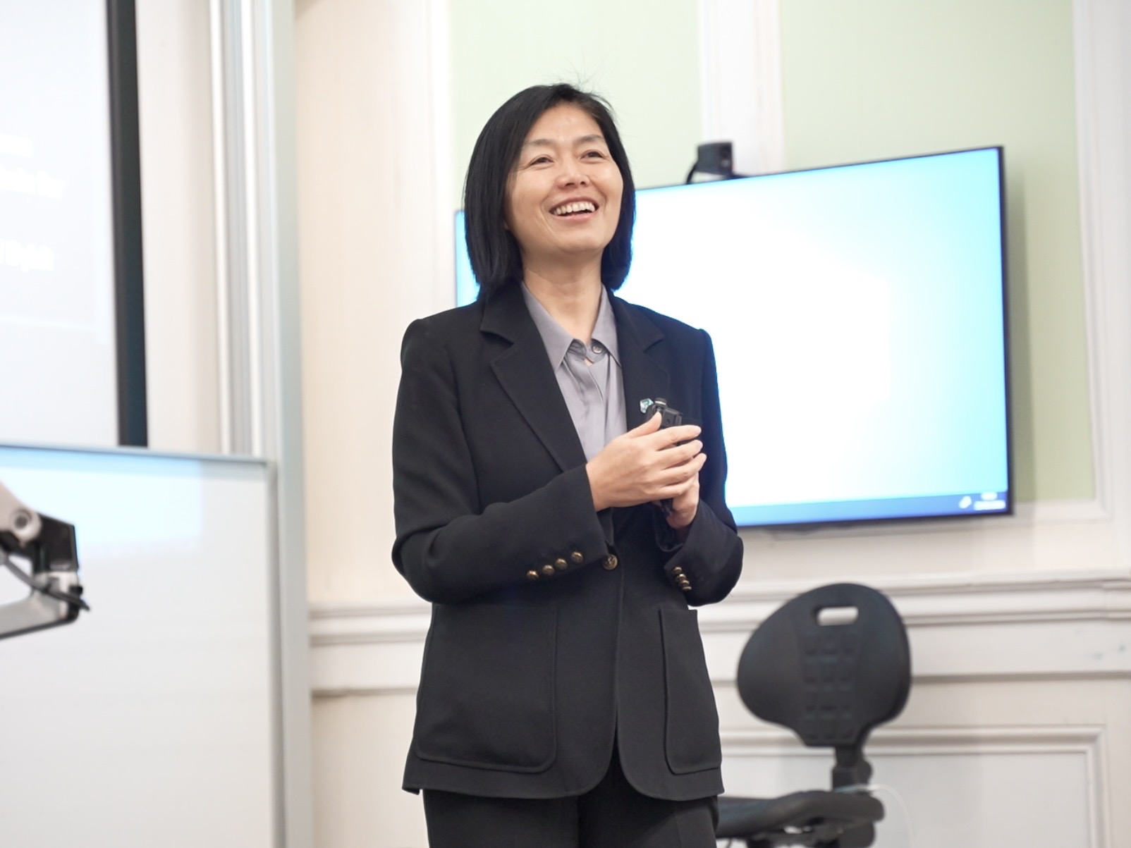 Helen Liu smiling while presenting