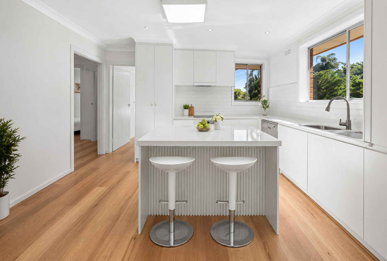 Modern white kitchen with island bench