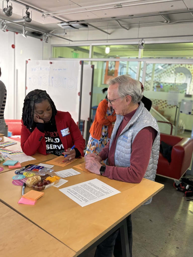 Intimate one-on-one conversation between an older male participant and a younger female participant