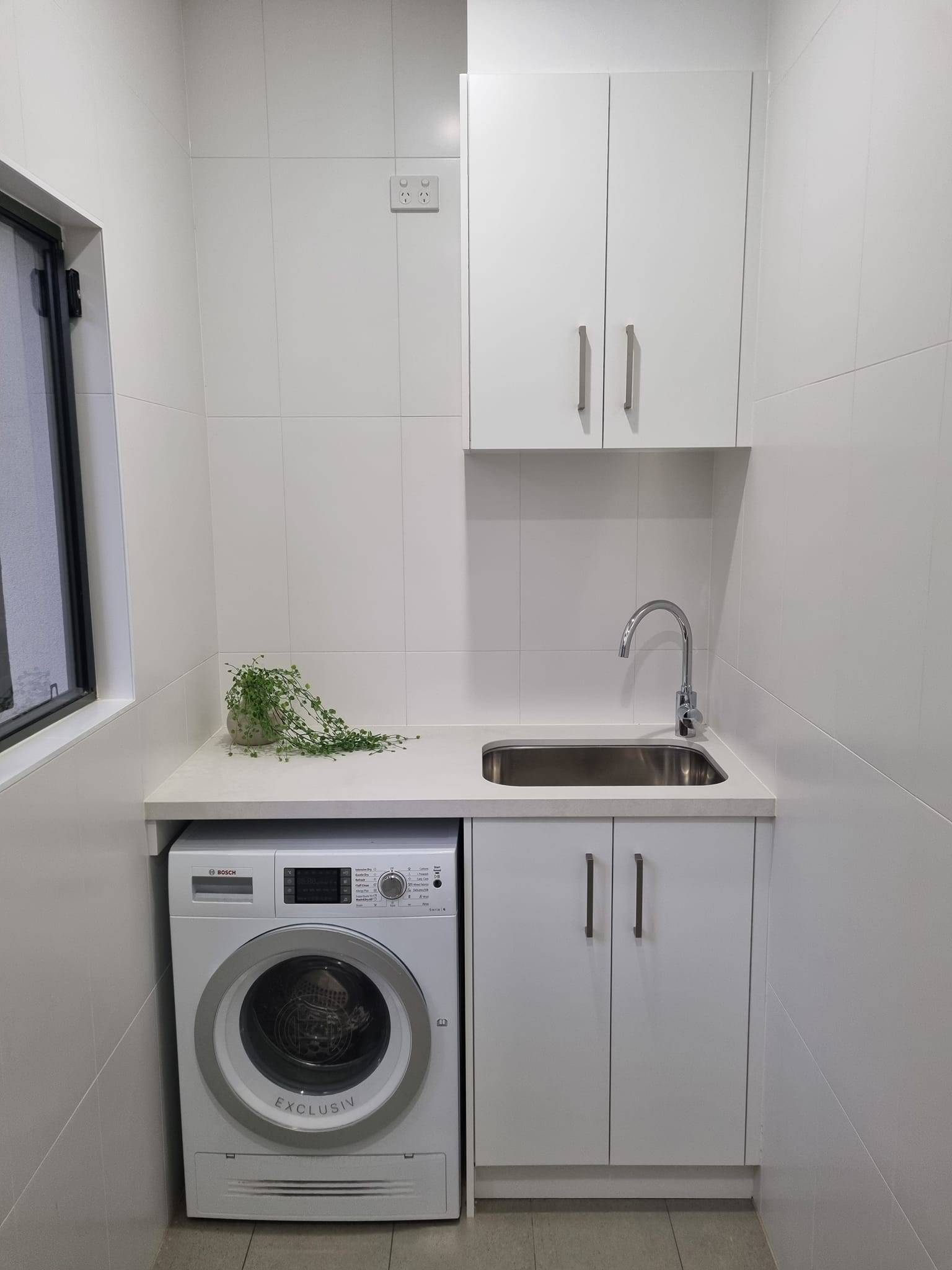 Natural timber bathroom vanity with three-drawer chest and freestanding basins