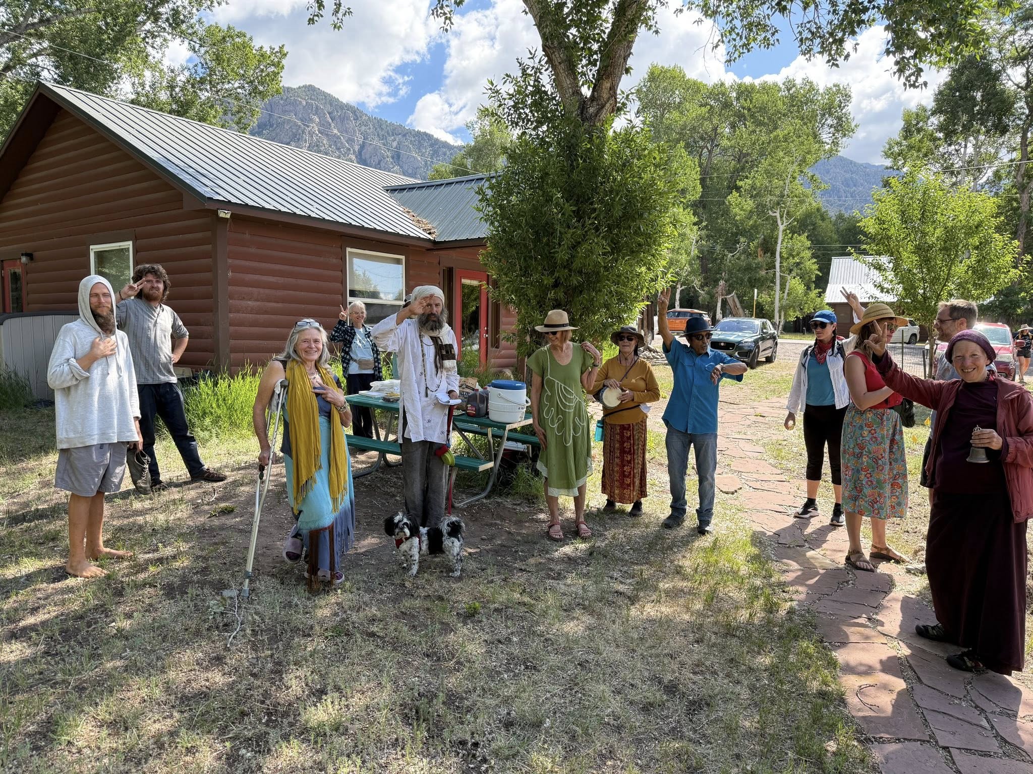 Community gathering in Crestone with diverse spiritual participants celebrating together