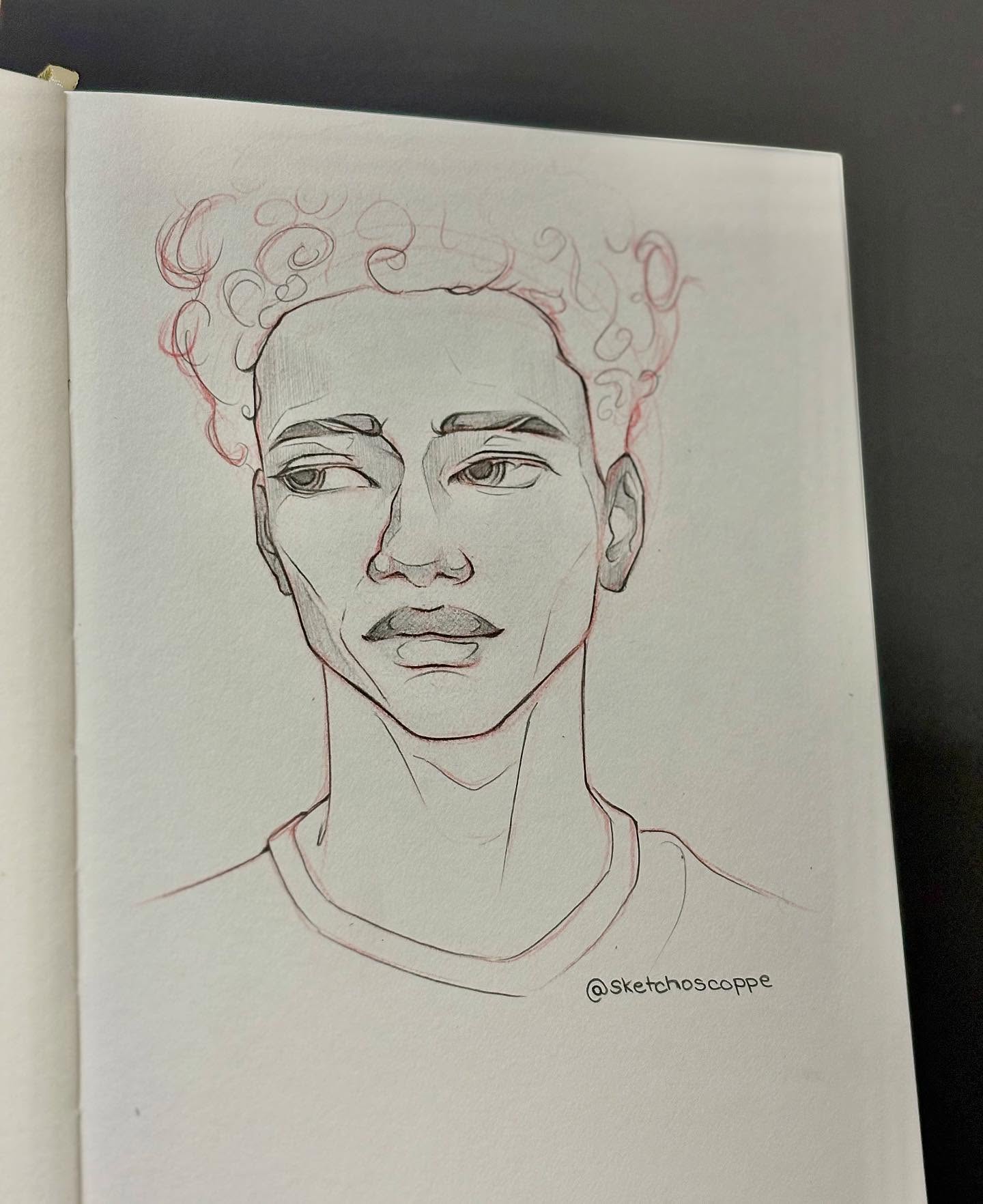 Graphite portrait of a man with curly hair, dark background