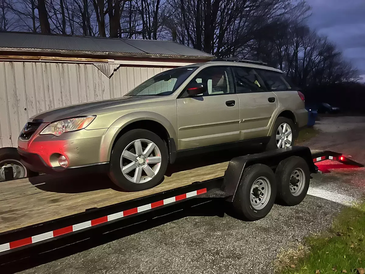 Vehicle being transported on car hauler trailer in Northwest Indiana