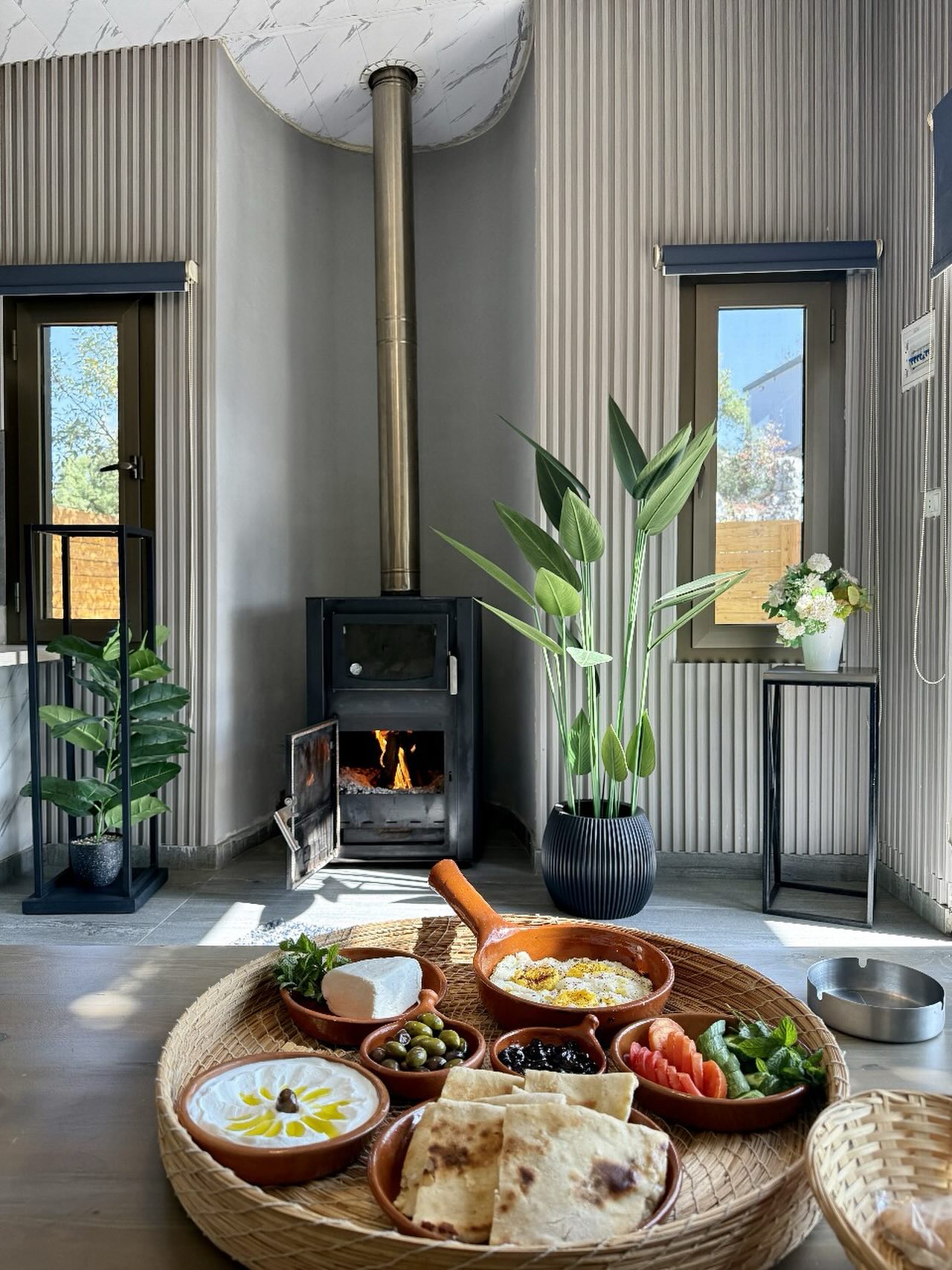 Cozy interior with fireplace and traditional Lebanese breakfast