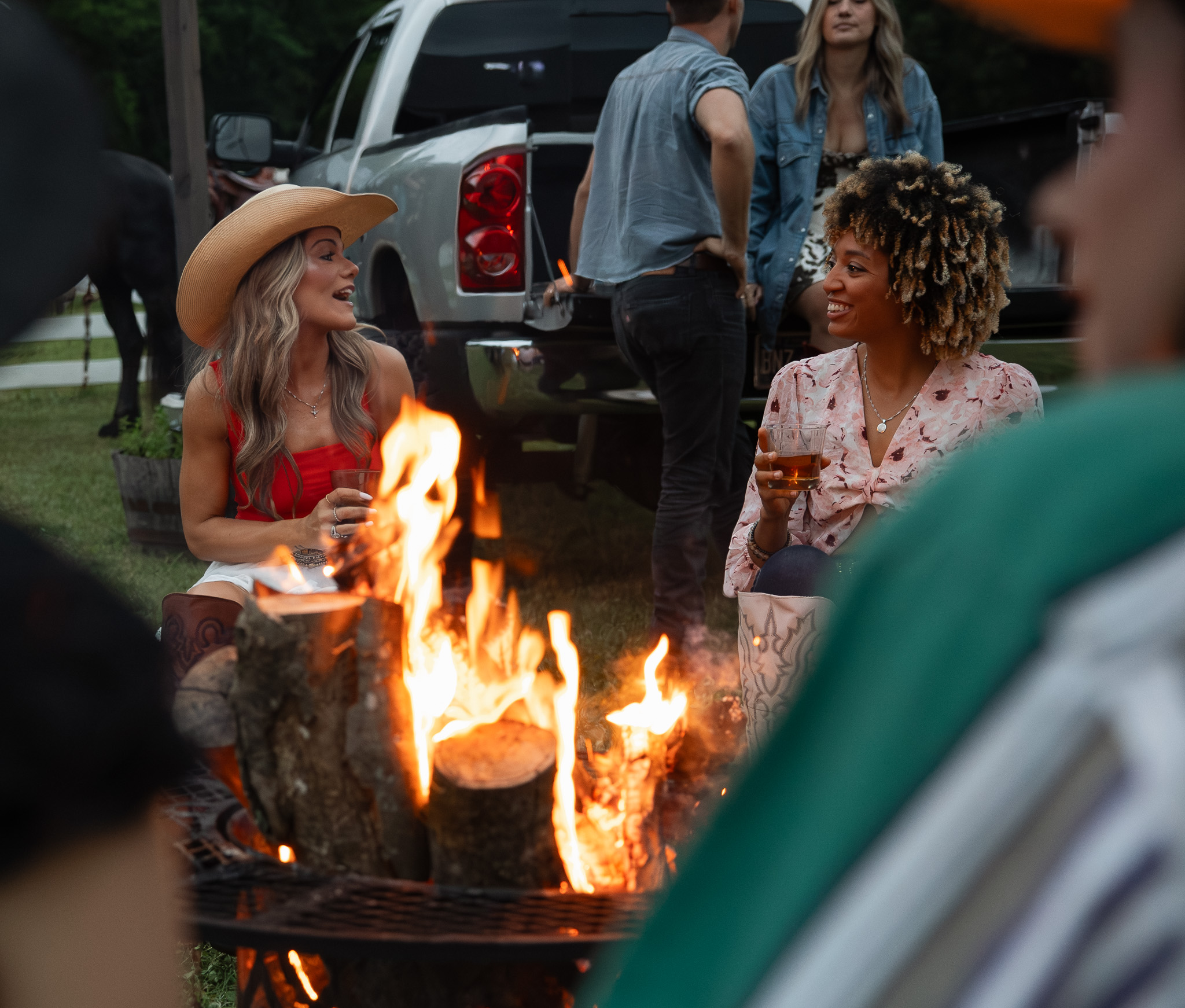 On set gathering around campfire during production