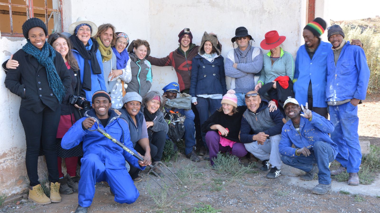 Large diverse group of volunteers and artists