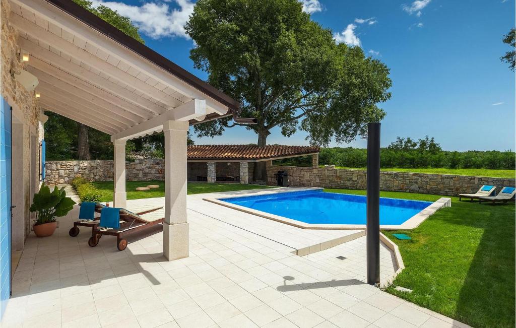 Pool terrace with loungers and covered porch