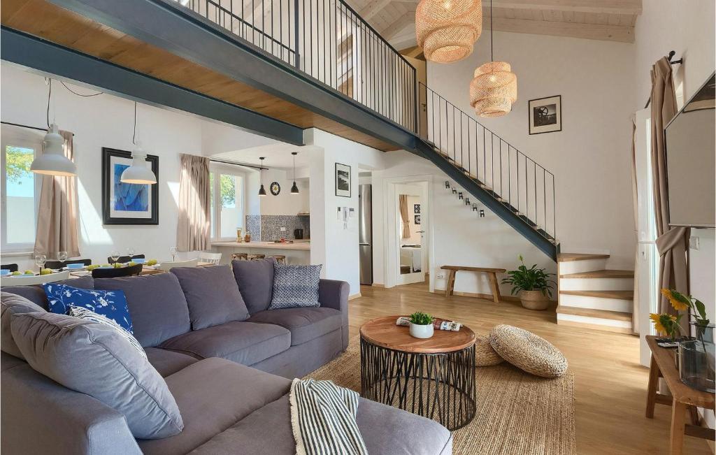 Open plan living with stairs and rattan lamps
