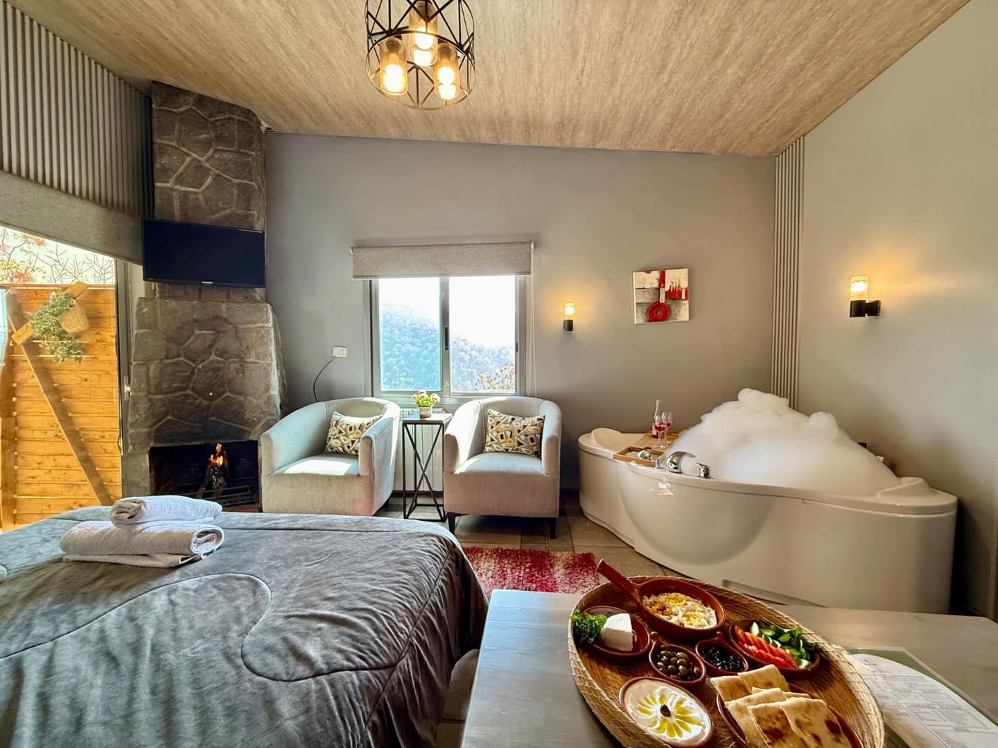 Luxury bedroom with jacuzzi and fireplace