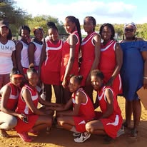 Team in red jerseys on field