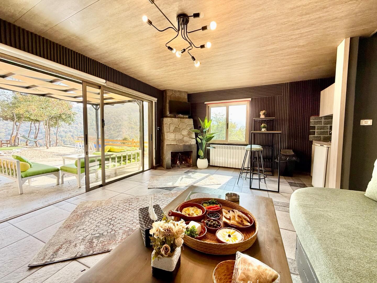 K Village Resort - Luxury living space with terrace and pool view