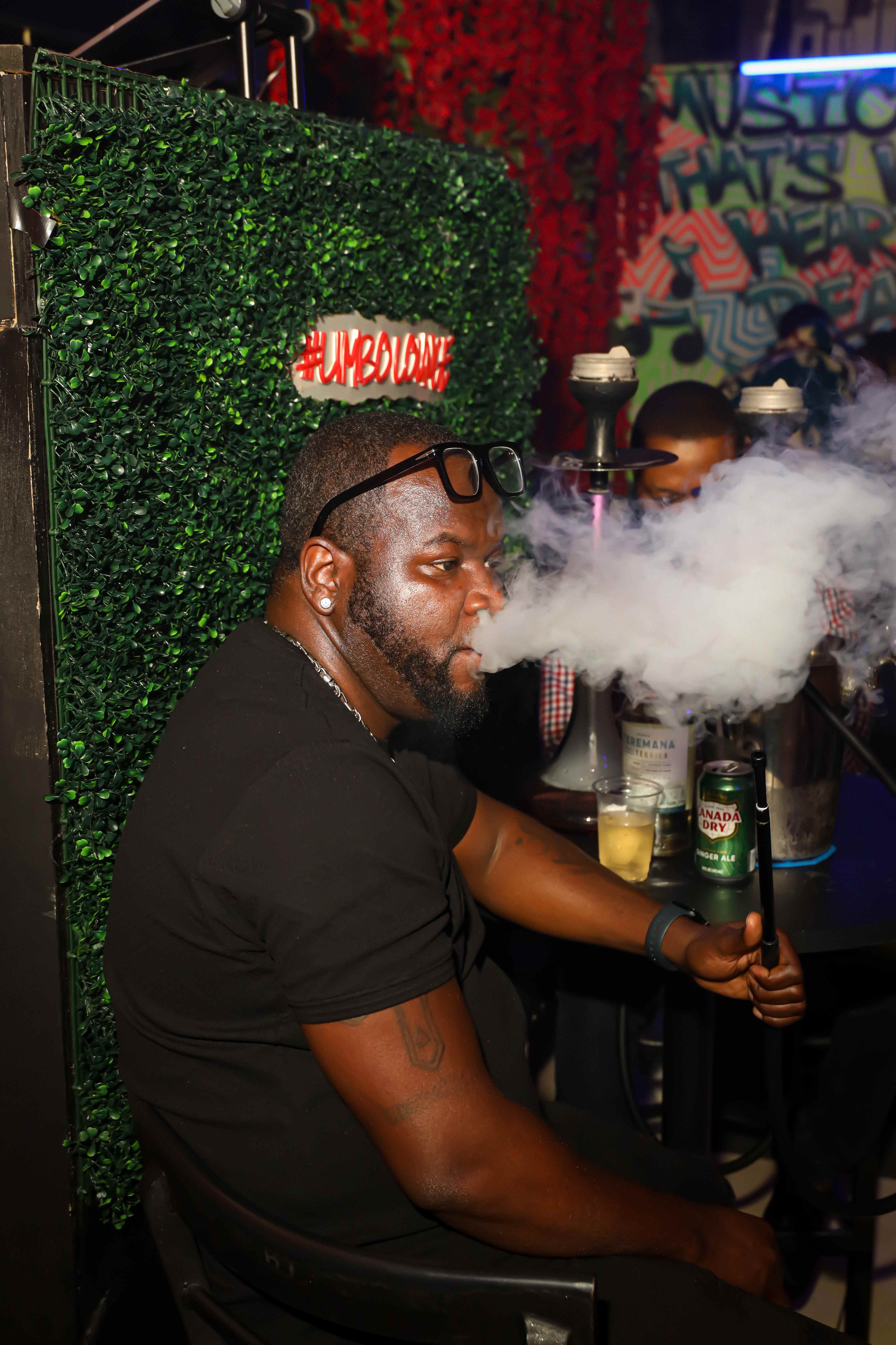 DJ booth with neon sign