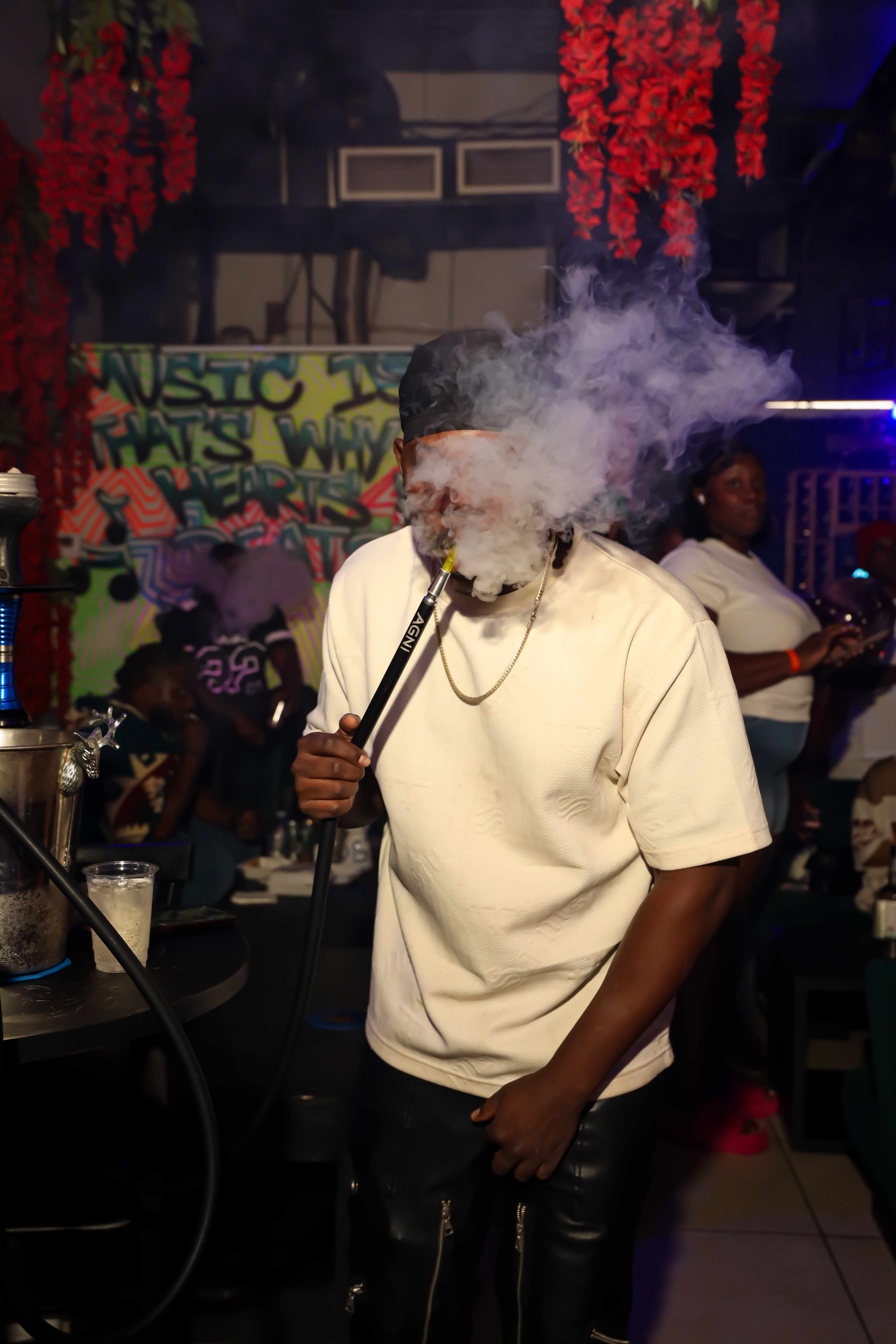 Guest enjoying hookah with smoke effect