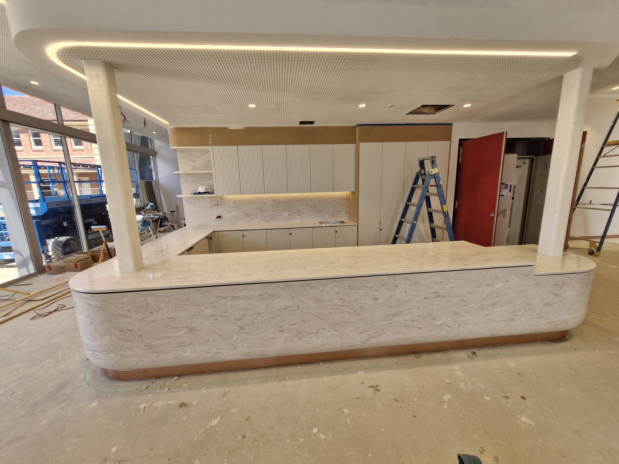 Large commercial curved marble counter installation
