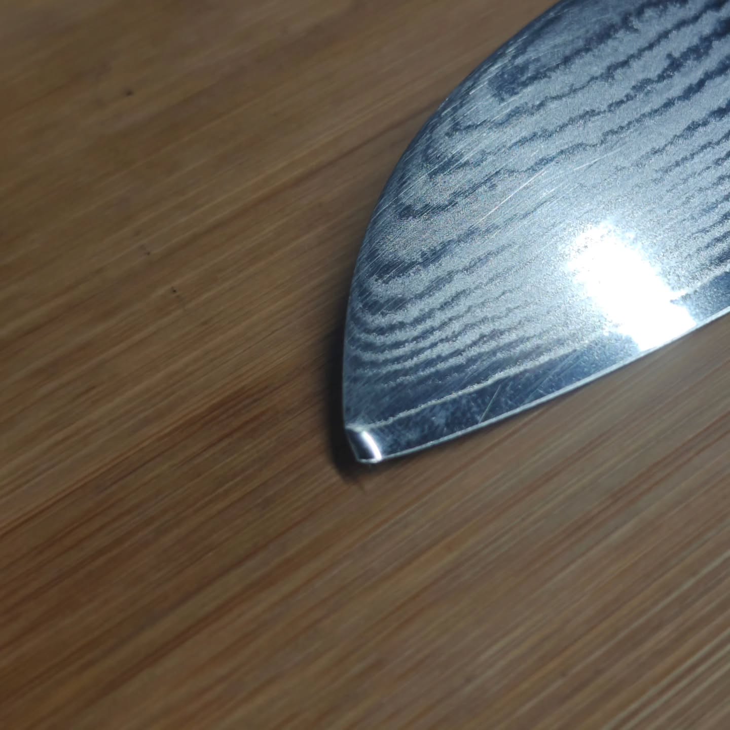 Damaged Damascus chef knife before professional sharpening