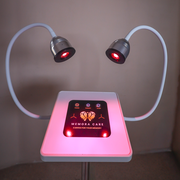 Illuminated MemoraCare unit with both red light heads glowing above the control panel