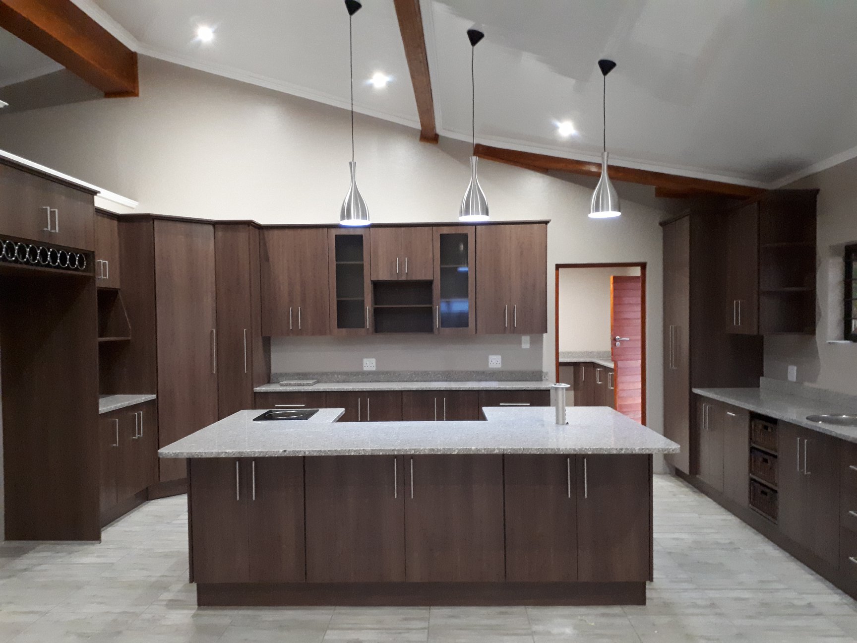 Dark Walnut Kitchen with Vaulted Ceiling