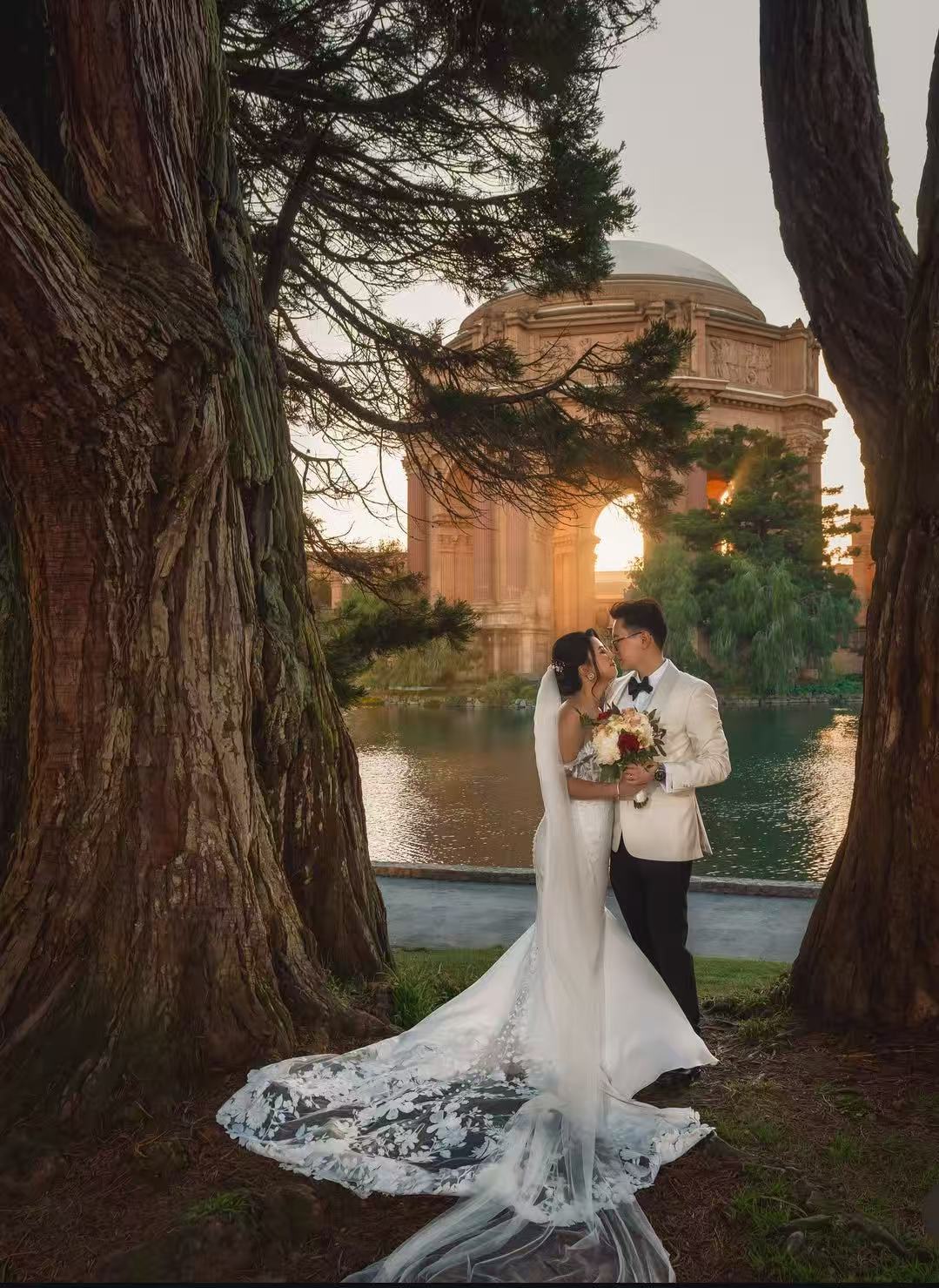 Couple at Palace of Fine Arts at sunset with flowing train