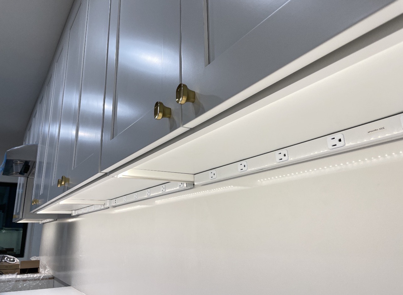 Integrated power strip with LED lighting