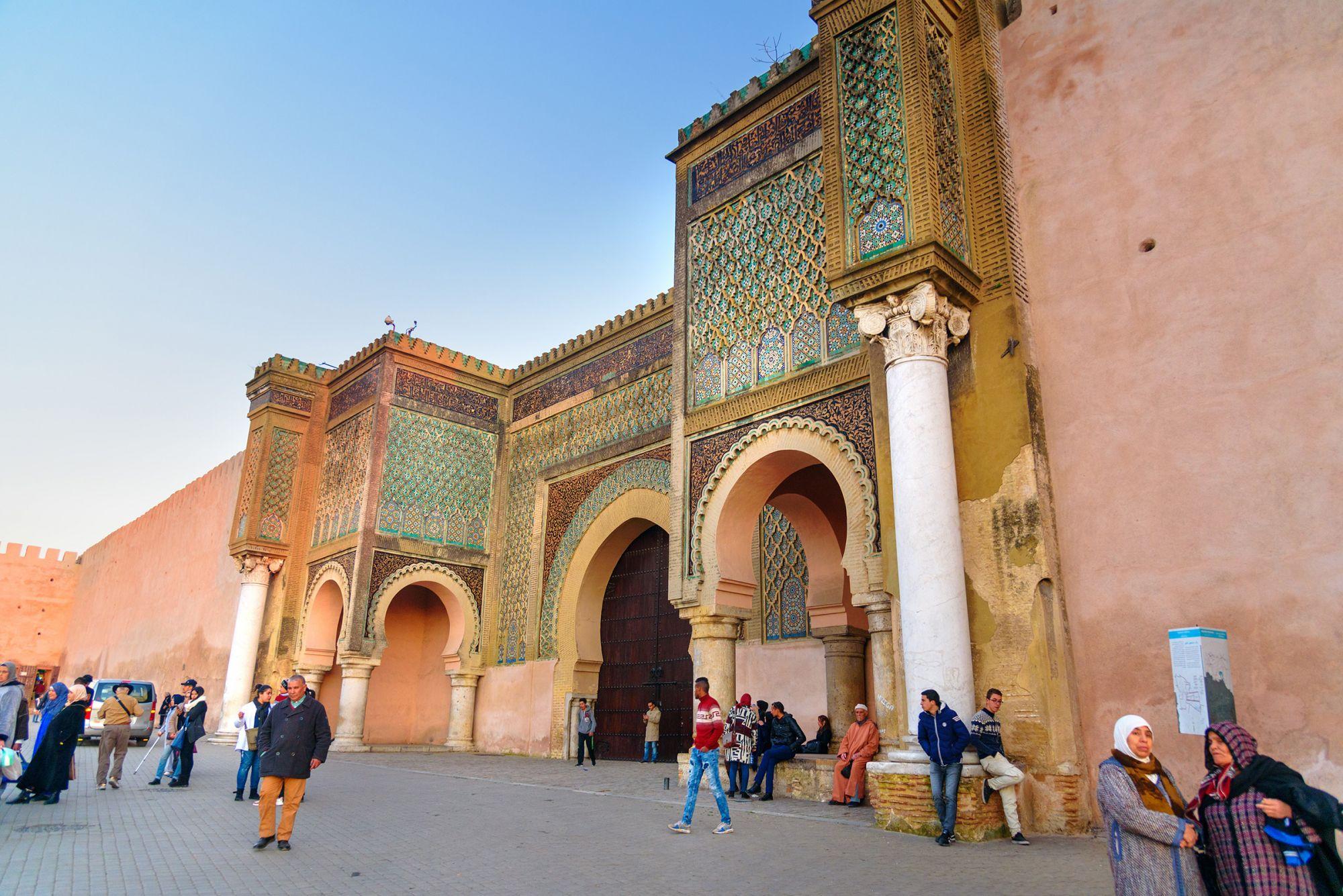 Ornate Moroccan city gate with tiled arches