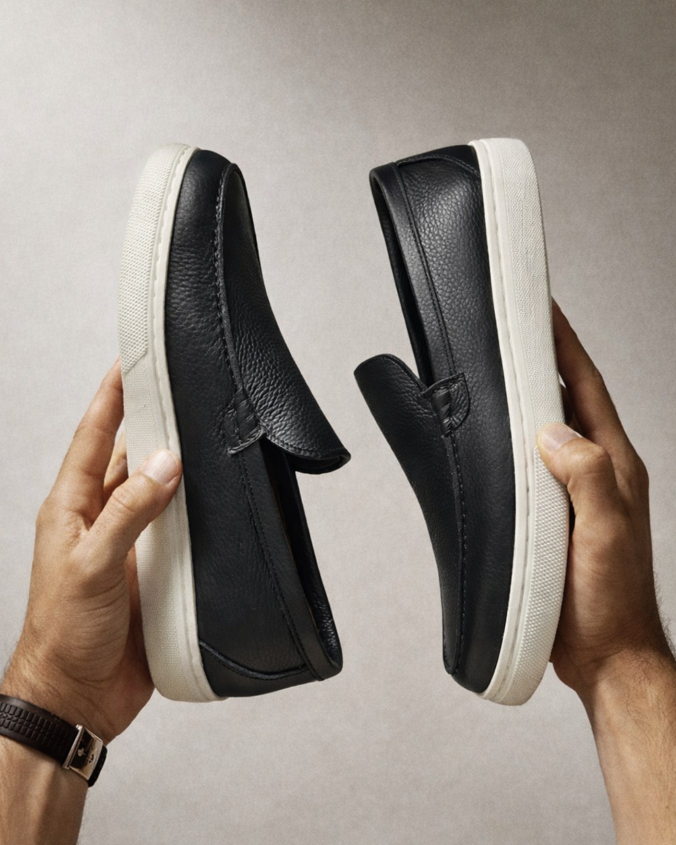 SOULIER craftsmanship - Premium leather loafers held in hands
