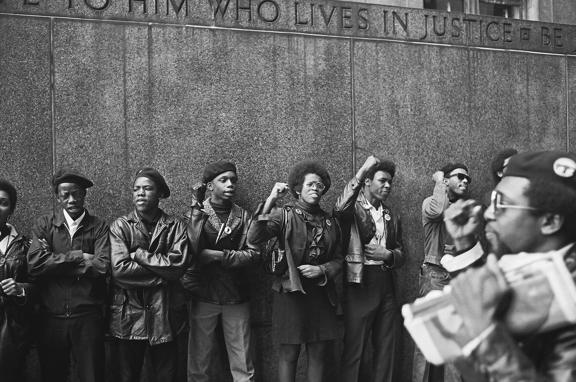 Black Panthers with raised fists - To Him Who Lives in Justice