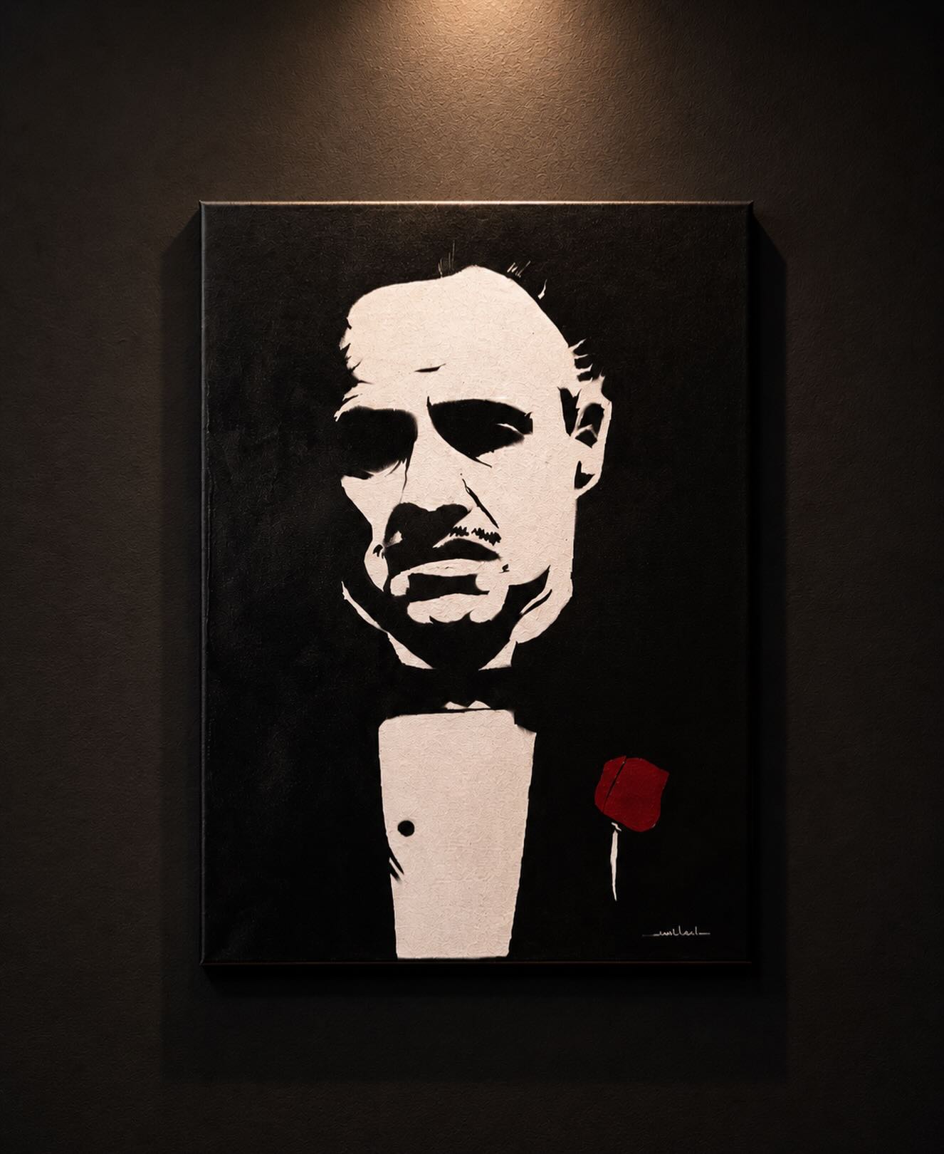 Dramatic black and white portrait with red rose
