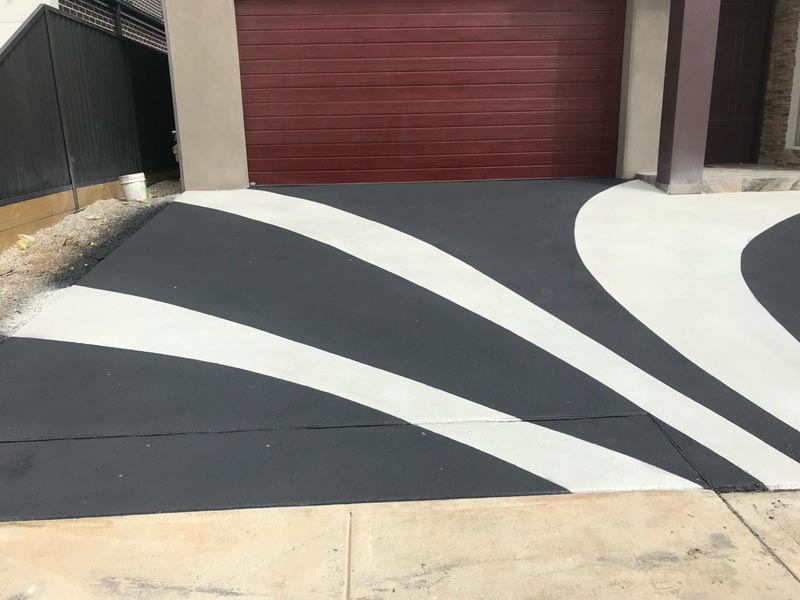 Same driveway after custom decorative Spray Crete resurfacing