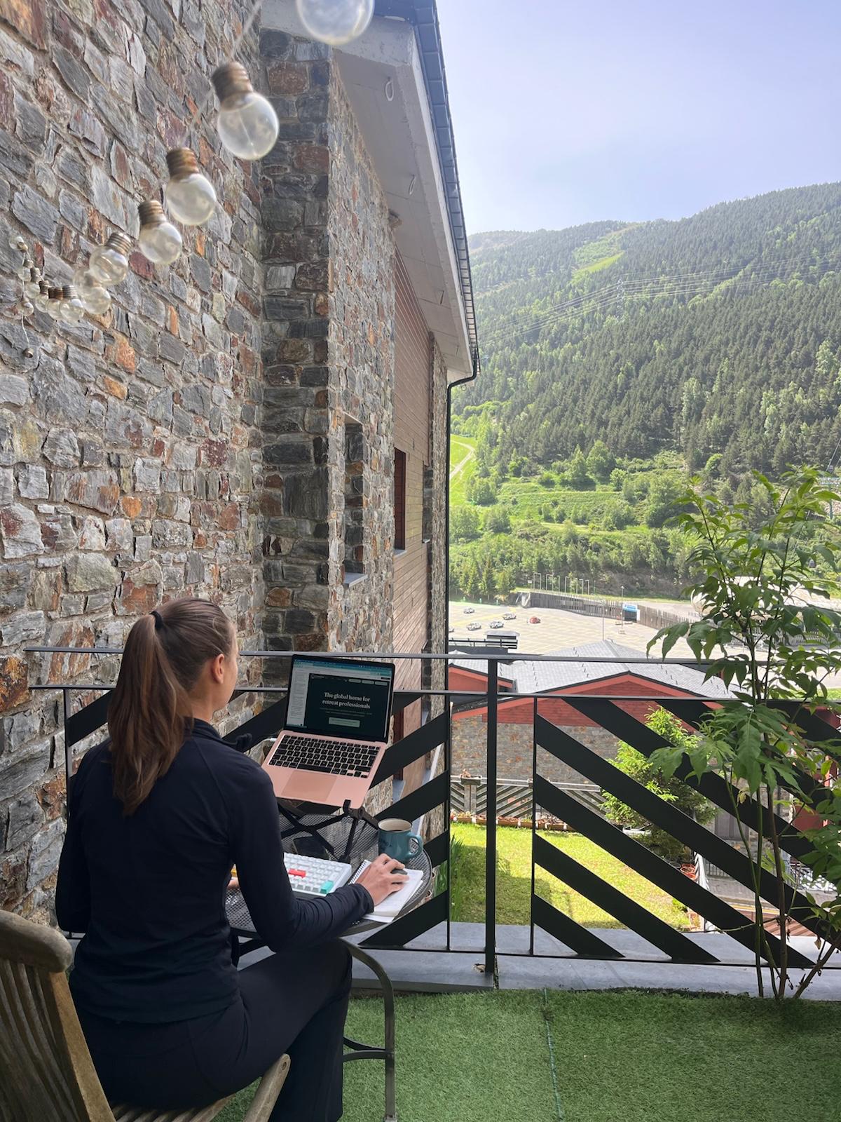 Building from a laptop in a scenic outdoor location