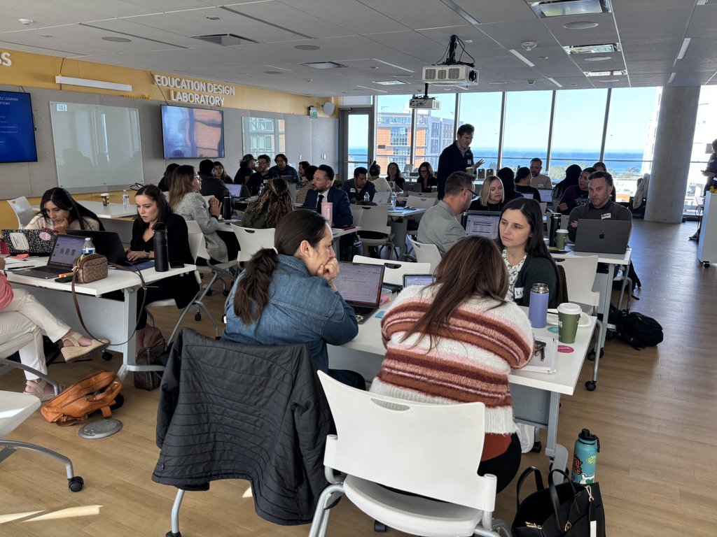 SoCal LiNK convening in the Education Design Laboratory with educators working at tables