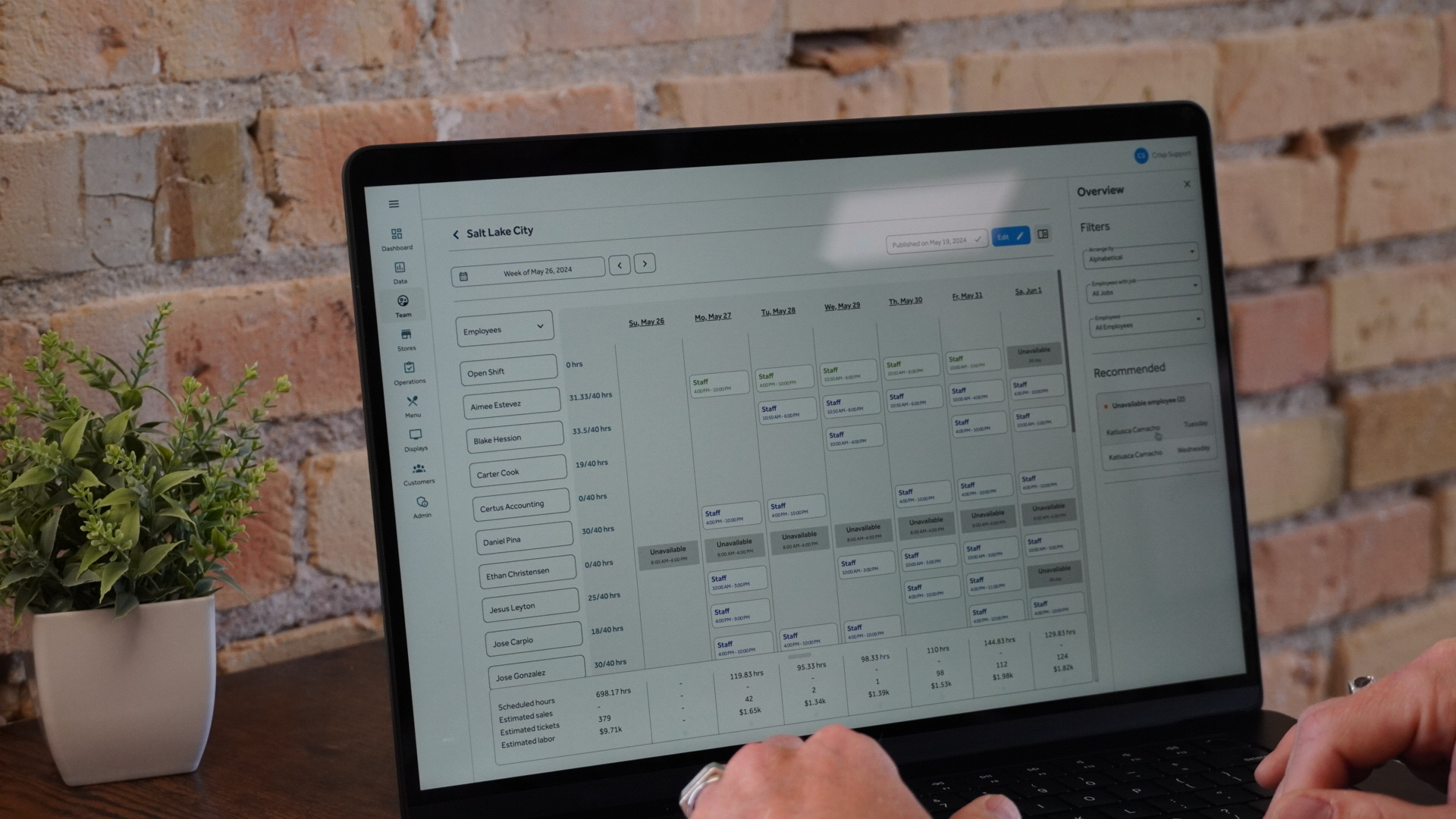 Staff scheduling interface showing employee shifts and calendar view