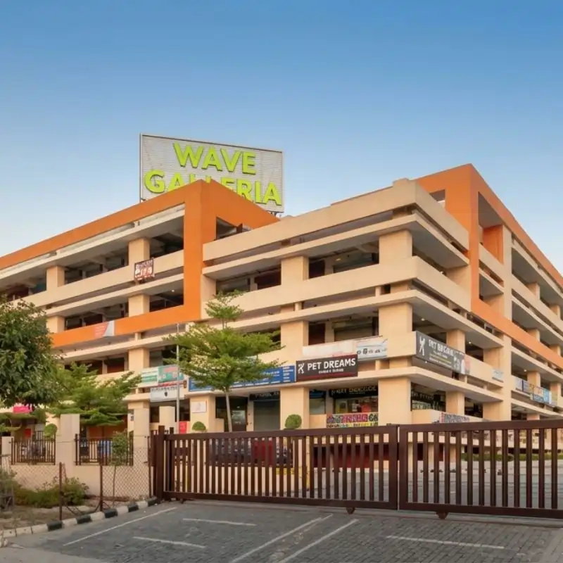 Wave Galleria entrance with retail shops and gated access