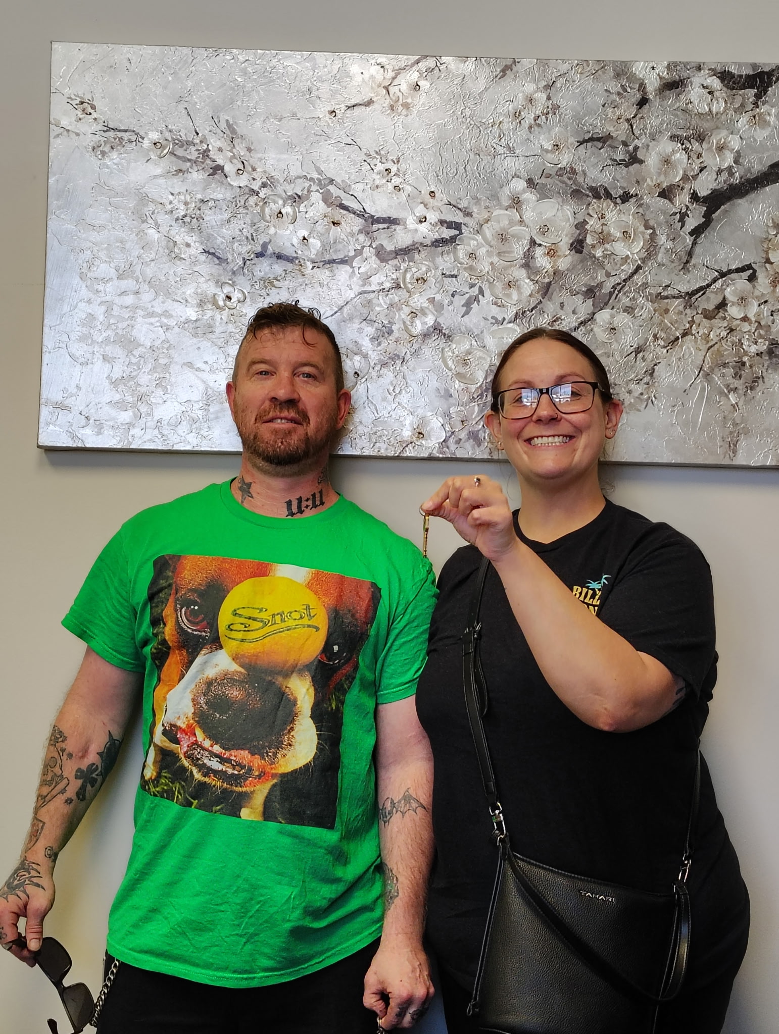 Happy couple holding keys to their new home