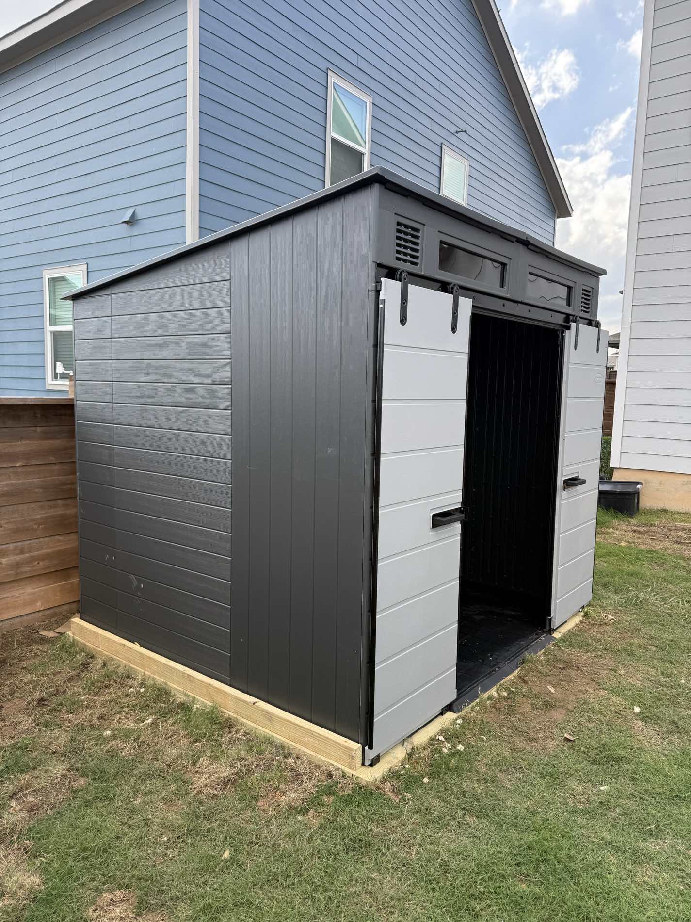 Storage shed assembly in backyard