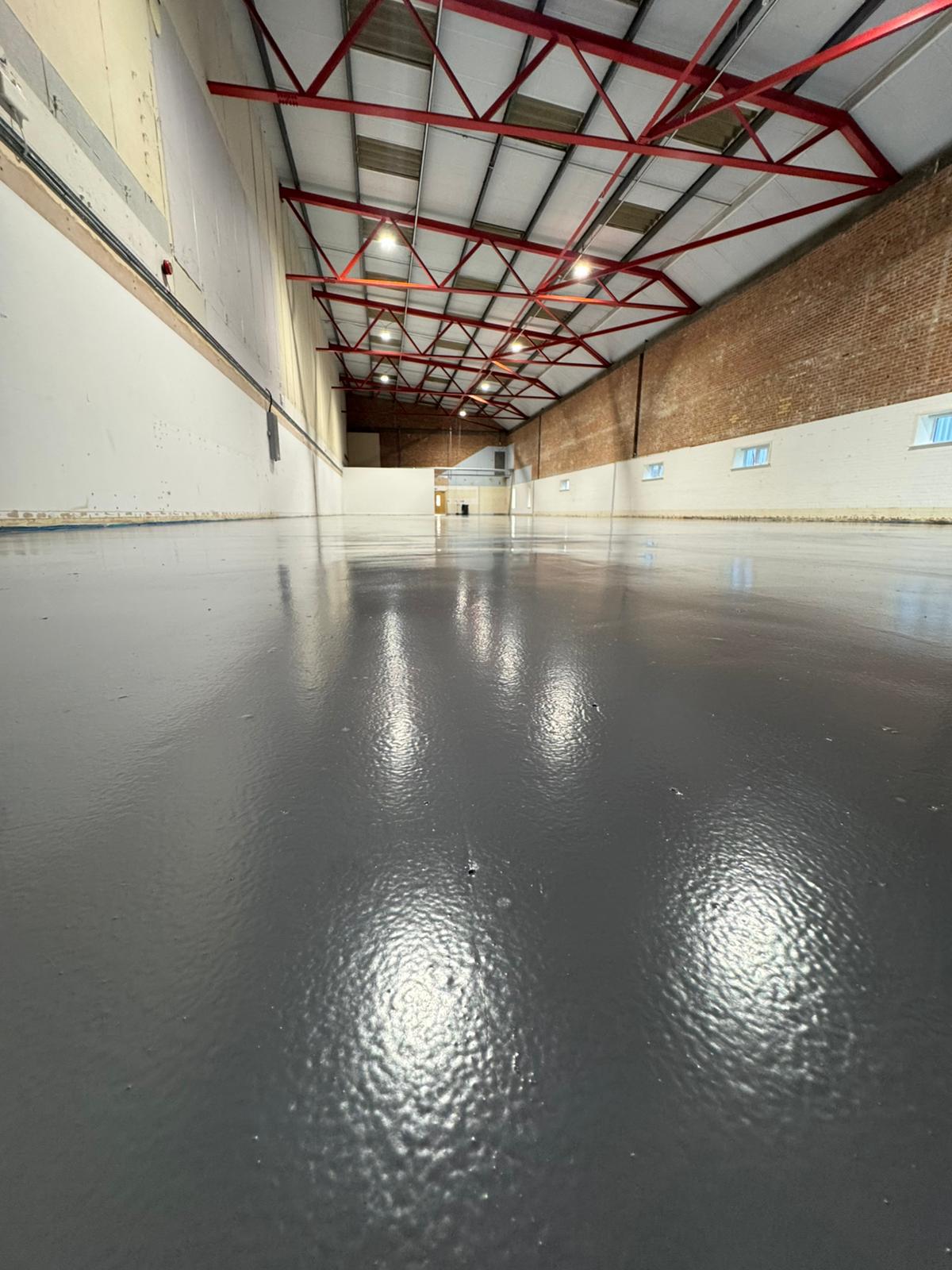 Industrial warehouse with grey resin flooring