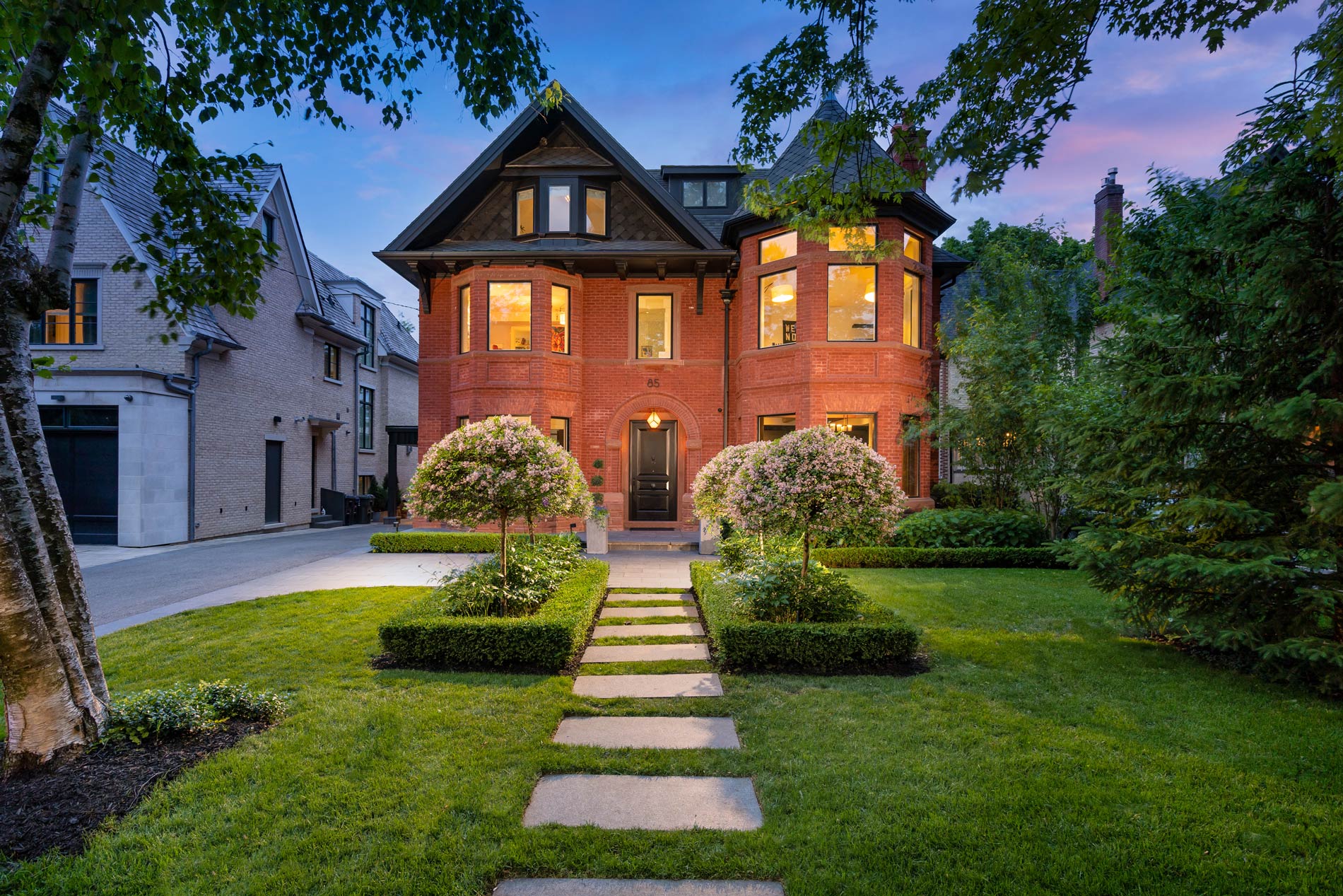 Victorian brick house exterior at dusk
