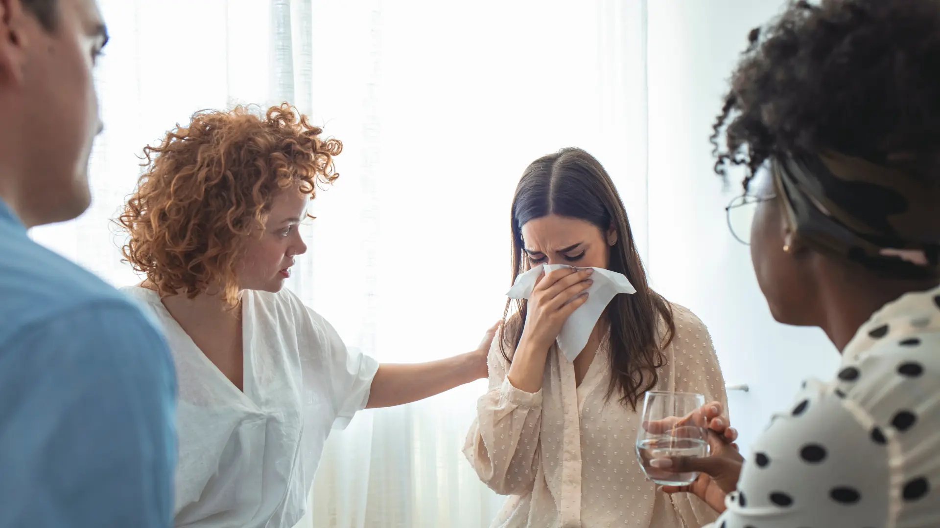 Woman being comforted, emotional support