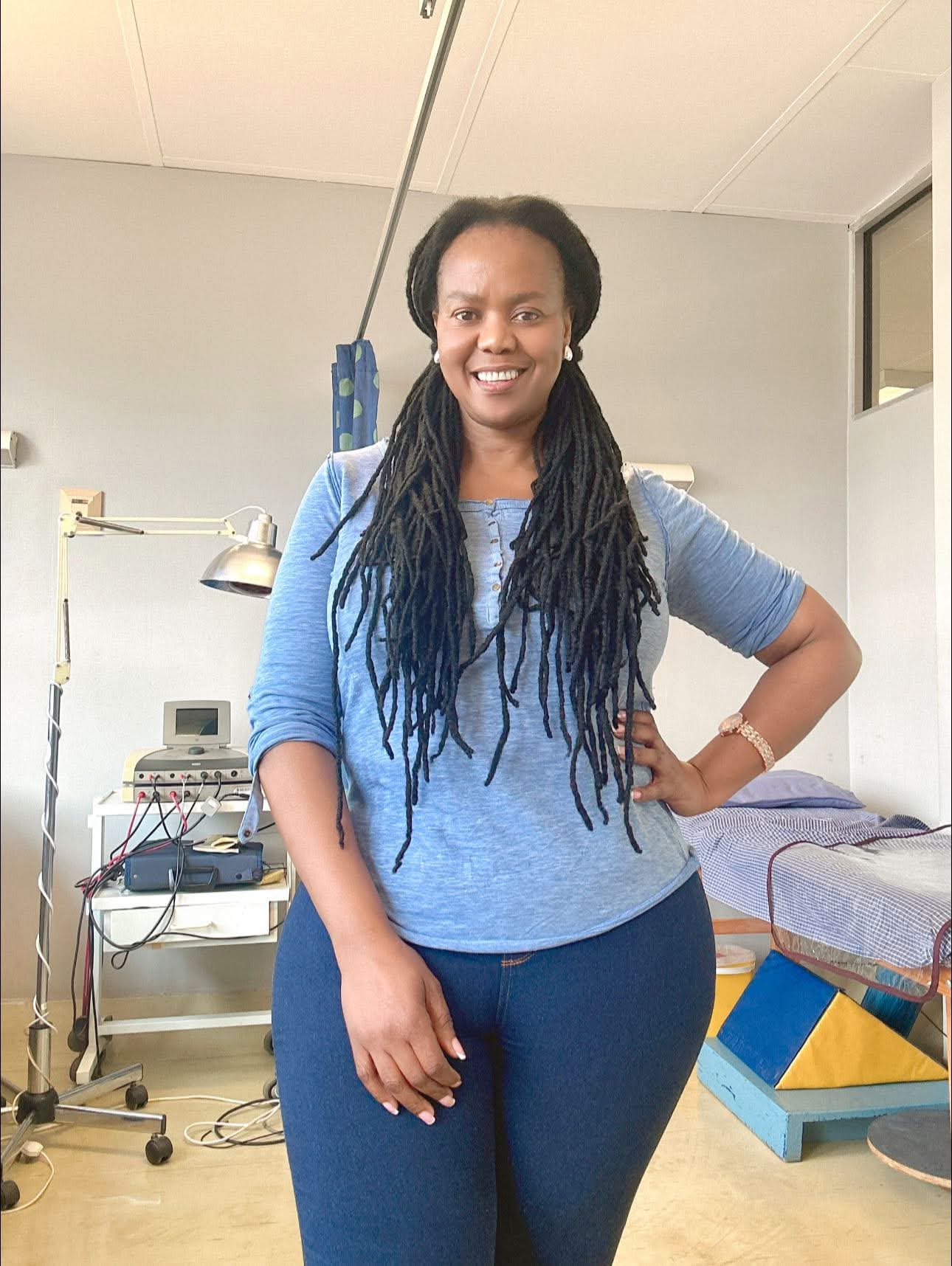Monase Letebele, Physiotherapist, standing in her consulting room